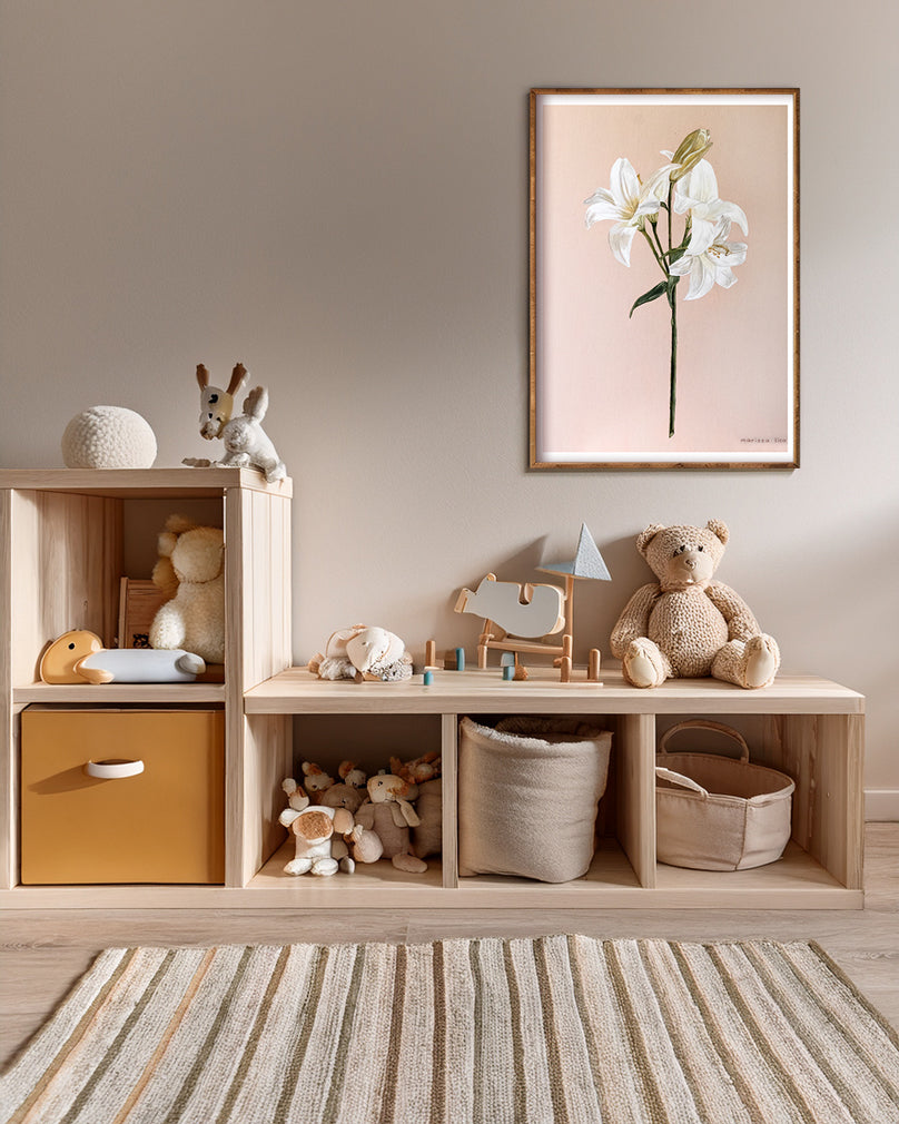 Fiori fine art print by Marissa Lico. Wooden shelf with toys and a framed print of a white lily flower in a room.