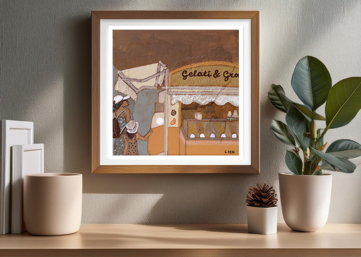 gelateria print by marissa lico, Framed artwork of a gelato shop on a shelf with decorative items.
