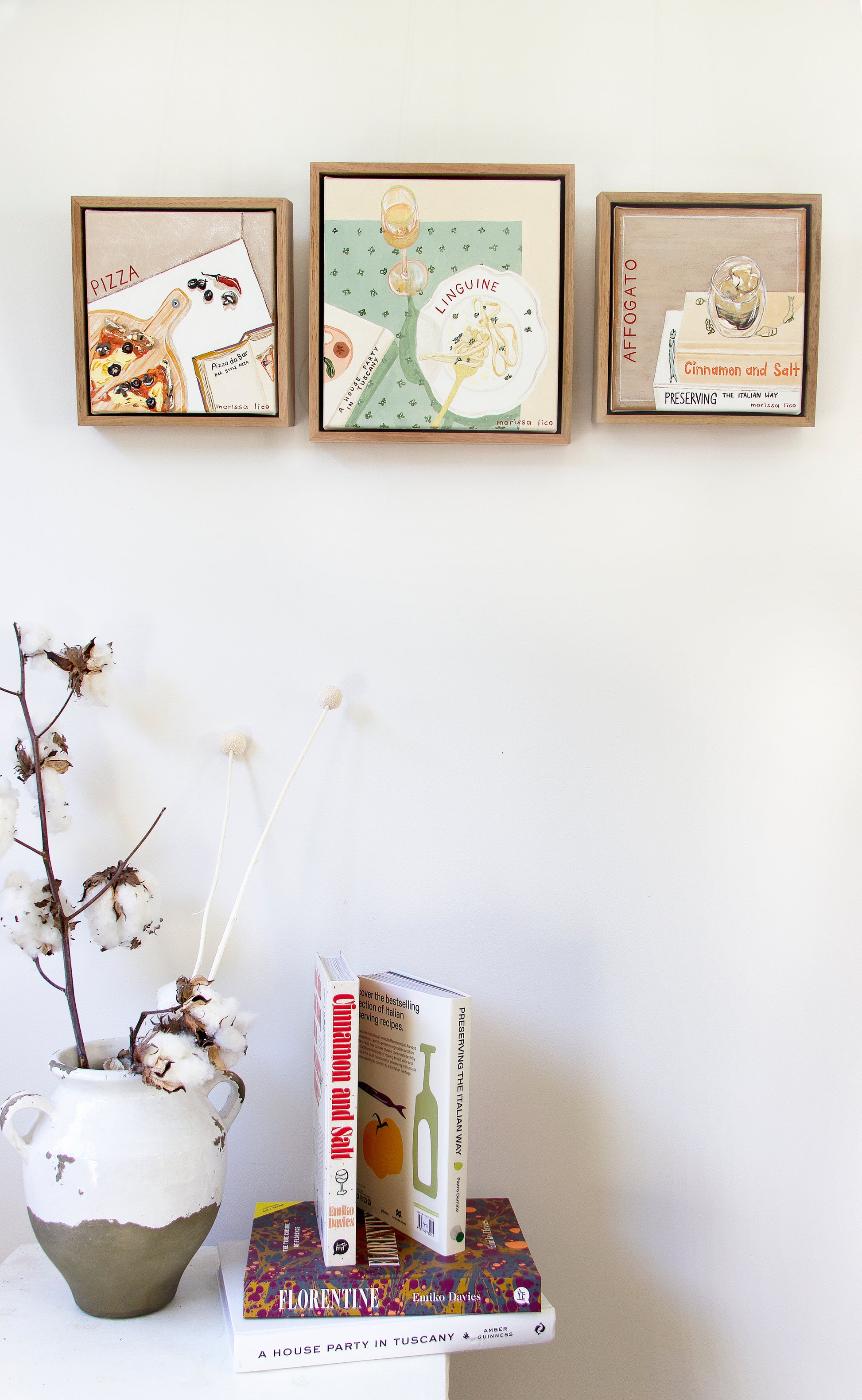 Domenica original painting by Marissa Lico. Linguine painting alongside other framed originals.