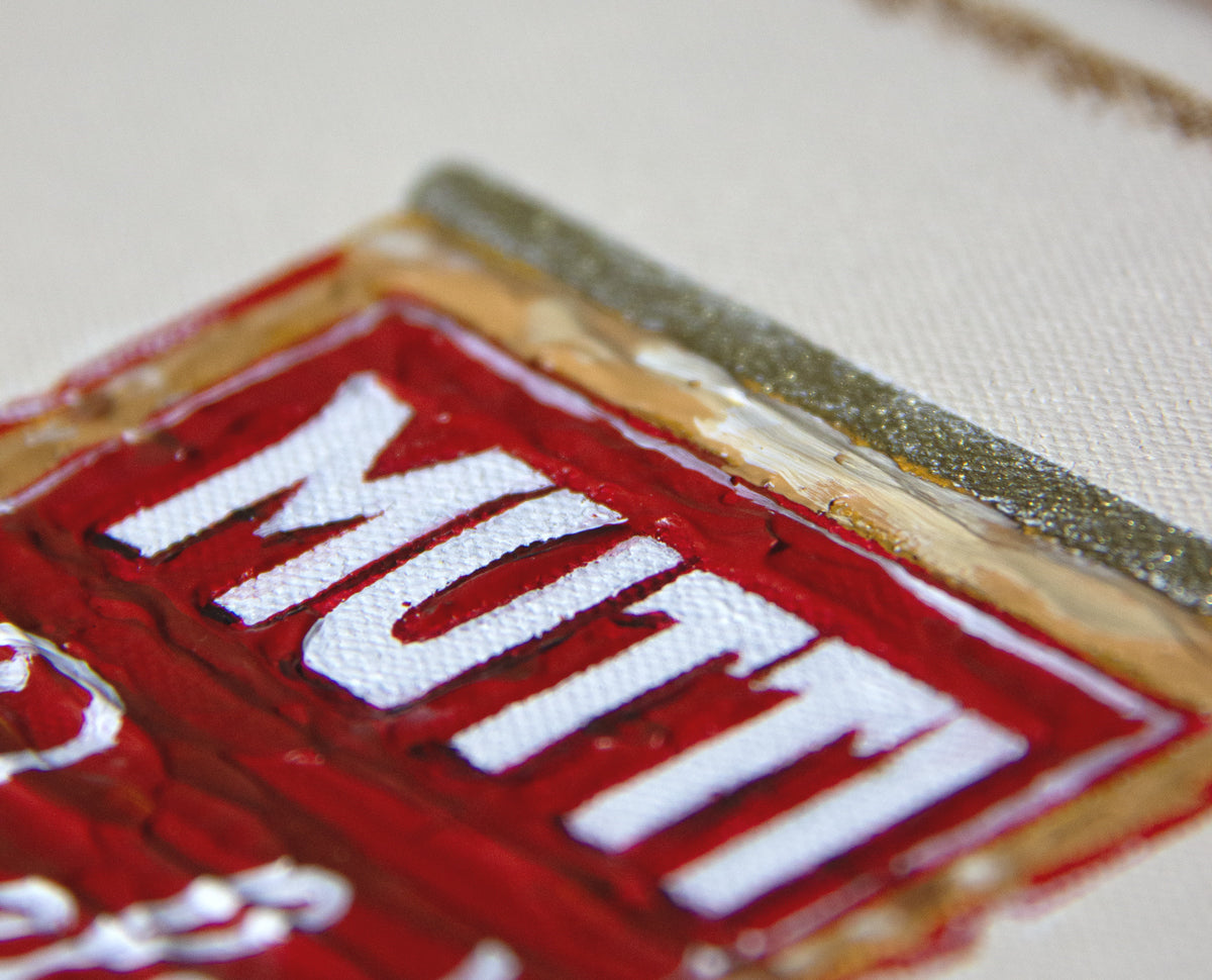 Mutti fine art print by Marissa Lico. Close-up of a red and white label with 'Mutt' text on a textured surface.