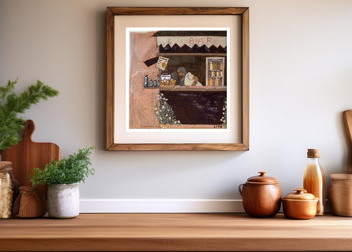 Nonna's Bar by marissa lico, Framed artwork on a wall above a wooden shelf with decorative items.
