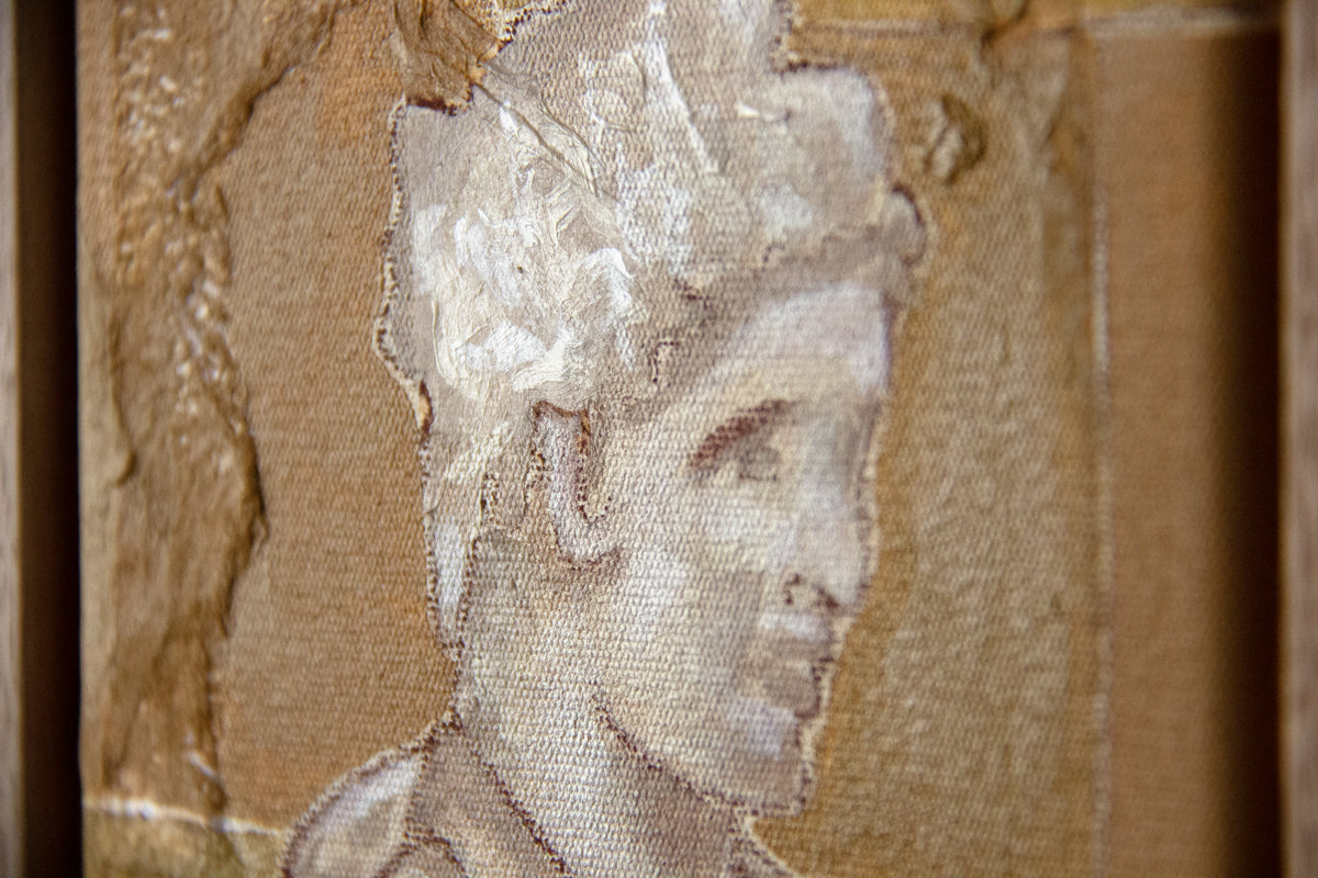 Roman Sculpture framed painting by artist Marissa Lico. Close-up of a textured surface with a person's face partially visible