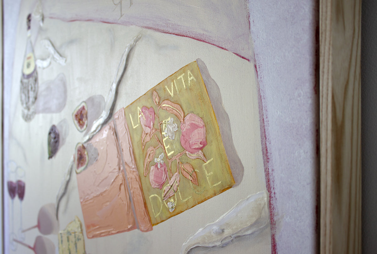 Toscana original painting by Marissa Lico. Artistic depiction of an Italian book titled 'La Vita e Dolce' with painted texture on a picnic rug in Tuscany.