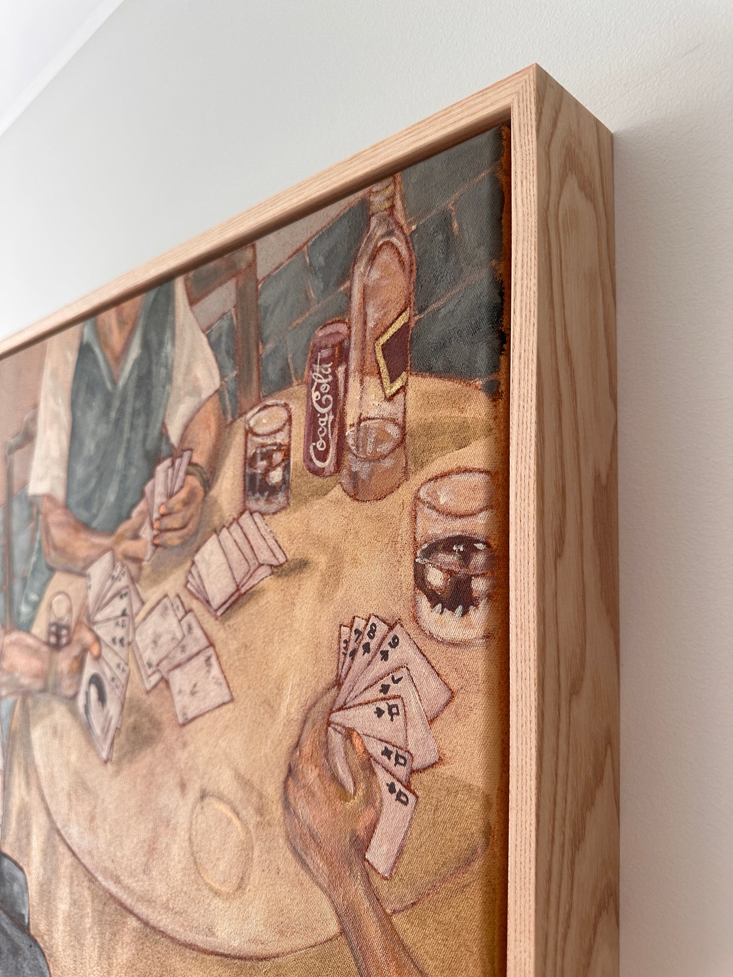 Close-up of textured acrylic brushwork showing hands holding playing cards over a Sunday table, from an original Italian family painting by Marissa Lico.