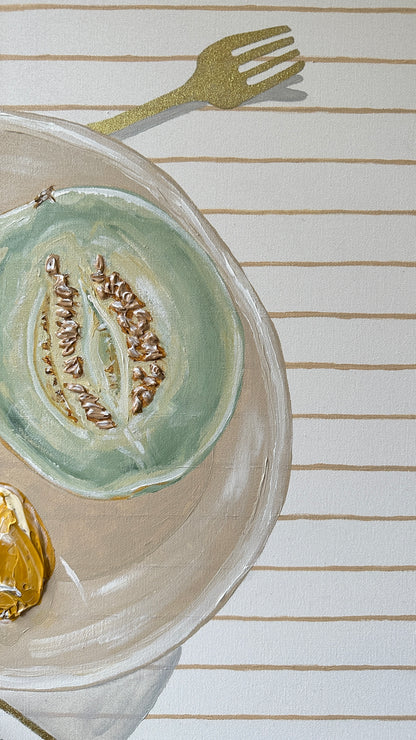 Pranzo II original painting by Marissa Lico, close up of half green melon and lemon in a bowl with gold fork on striped beige tablecloth.