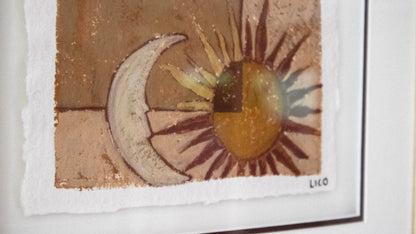 A close-up of a framed art painting featuring a textured painting of a crescent moon and a sun in earthy brown, beige, and ochre tones, with a white mat frame and artist signature  'LICO' in the bottom right.