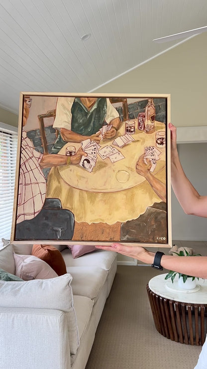 Video panning across an original acrylic painting of a family playing cards around a Sunday table, showing the textured brushwork up close.
