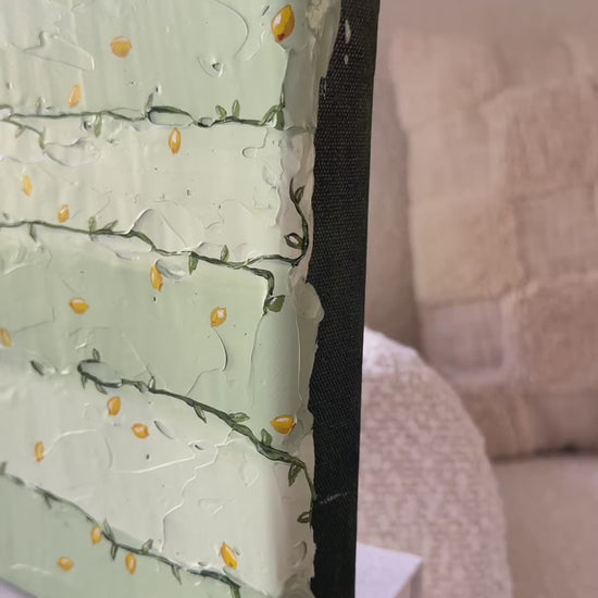 Tanto Limone by Marissa Lico, video of original painting sitting on books in nursery.